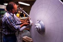 Jim Dow working on the Enterprise miniature's impulse engine housing, with the original bridge superstructure clearly show.