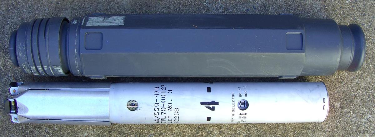 CNU-239/E shipping container and SSQ-47B sonobuoy.