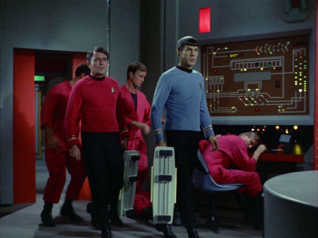 Spock and Scotty arrive in engineering with anti-grav devices, from the Star Trek: The Original Series season 2, episode 8 "The Changeling".