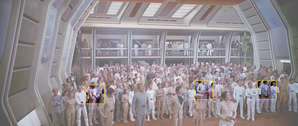 Rec. room briefing scene from ST:TMP with the crew extras wearing the enviro tech suit costume.